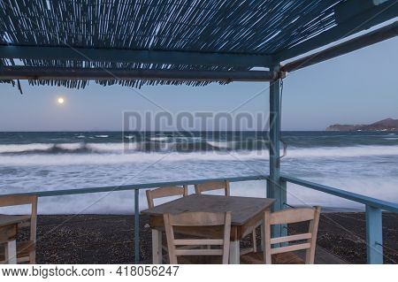 Beautiful Black Beach With Coast And Sea In Vlichada With Blue Sky Background With White Clouds And 
