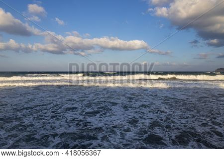 Beautiful Black Beach With Coast And Sea In Vlichada With Blue Sky Background With White Clouds And 