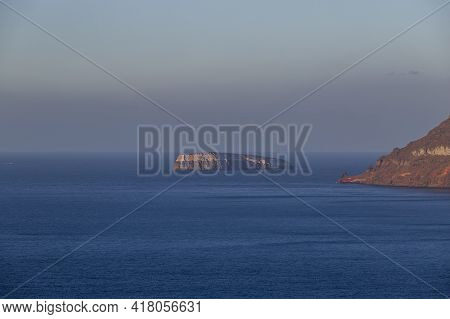 Beautiful Black Beach With Coast And Sea In Vlichada With Blue Sky Background With White Clouds And 