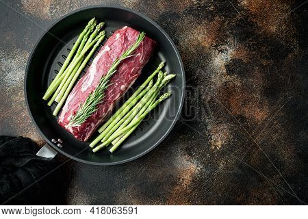 Fresh And Raw Fillet Meat. Whole Piece Of Beef Tenderloin Steaks Set, On Frying Cast Iron Pan, On Ol