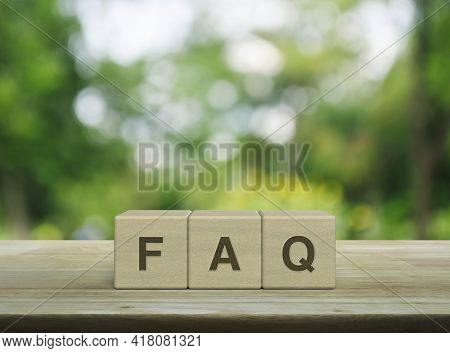 Faq Letter On Block Cubes On Wooden Table Over Blur Green Tree In Park, Frequently Asked Questions, 