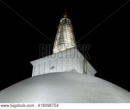 Ruwanwelisaya Stupa Glowing In The Night, It Is A Hemispherical Structure And Containing Sacred Budd