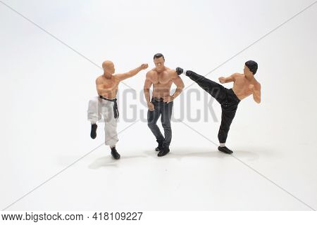 A Mini  Kung Fu Martial  Fighters  With Shirtless Stong Man