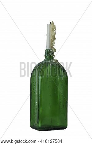 Candle In The Vintage Green Bottle Isolated On White