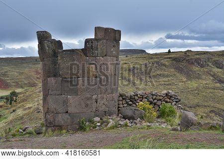 Sillustani Tombs In The Peruvian Andes Near Town Puno, Peru.
An Inca Burial Tower At The Sillustani 