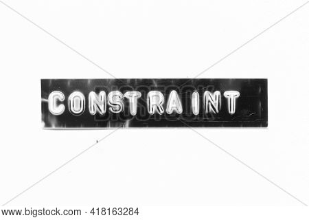Embossed Letter With Word Constraint In Black Banner On White Paper Background