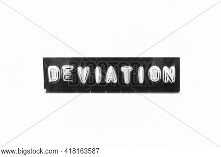 Embossed Letter With Word Deviation In Black Banner On White Paper Background