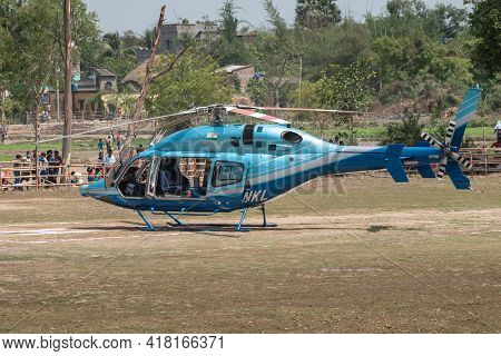 Kandra, West Bengal, India - April 19, 2021; A Helicopter Is Landed In A Rural Area In India And The