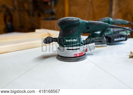 Miercurea Ciuc, Romania- 25 April 2021: Metabo Wood Sanders In Row In A Small Woodworking Shop.