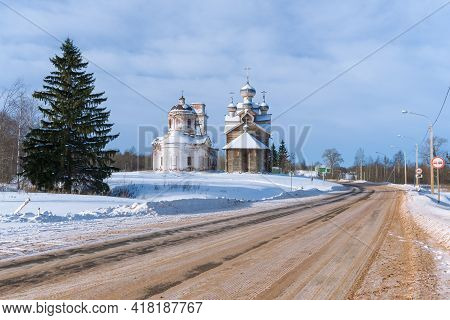 Two Old Churches By The Road In The Winter Landscape. Paltoga, Vologda Oblast. Russia