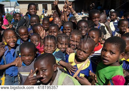 Mzuzu, Malawi. 30-05-2018. A Crowd Of Children Are Happily Looking At The Camera After The School Da