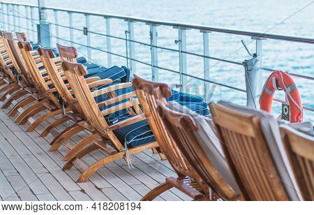 Empty Cruise Ship Main Deck With Deckchairs With No People Around. Cruise Vacation Theme.