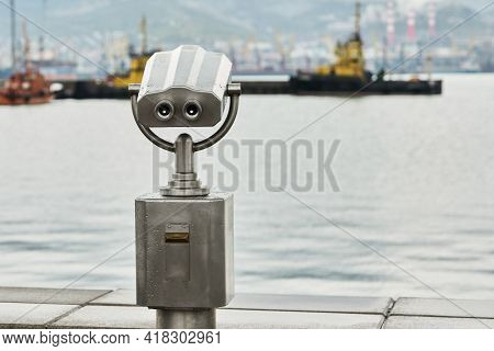 An Observation Deck On The Embankment, Equipped With A Stationary Viewing Binoculars With A View Of 