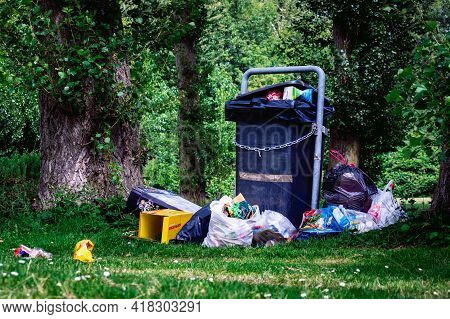 Amsterdam, The Netherlands July 19, 2020: Overflown Garbage Container In A Park