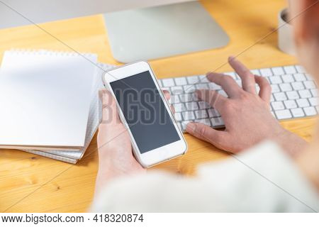 Hands Of Women Who Use Laptop Keyboard And Mobile Phone. Concept Of Email Delivery And Use Of Online