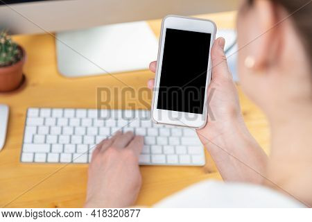 Hands Of Women Who Use Laptop Keyboard And Mobile Phone. Concept Of Email Delivery And Use Of Online