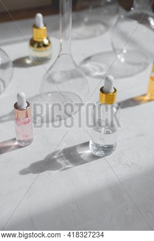 Eco Mineral Oil In Glass Bottles With Pipette Dropper. Transparent Hyaluronic Serum Gel And Skin Car