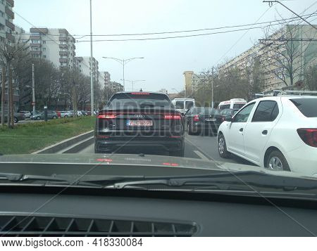 Black New Audi Q8 In Traffic. Road View Through Car Windshield, Cars On Road In Traffic In Bucharest