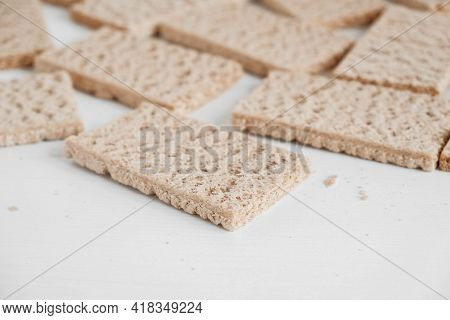 Rye Crisp Bread On A White Wooden Background. Top View. Copy, Empty Space For Text