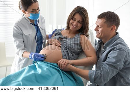 Doctor Examining Woman Before Giving Child Birth In Maternity Hospital