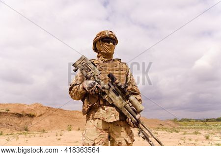 Equipped And Armed Special Forces Soldier With Sniper Rifle. Concept Of Military Anti-terrorism Oper