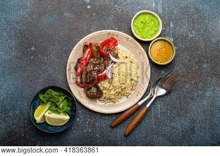Traditional Dish Of Peru Lomo Saltado Made Of Beef Tenderloin With Peppers Served On Ceramic Plate W