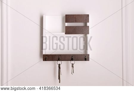 Wooden Hanger For Keys On White Wall