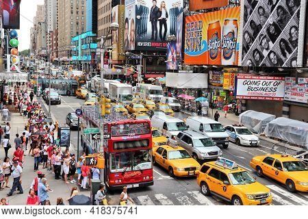 New York, Usa - July 3, 2013: People Visit 7th Avenue Near Times Square In New York. The Square At J