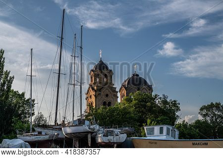 Church Of St. Ilya And Sail Boat On The Embankment Of City Of Yevpatoria On The Peninsula Crimea In