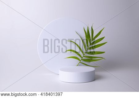 White Podium On The White Background With Tropical Leaf. Podium For Product, Cosmetic Presentation. 