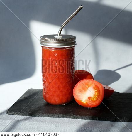 Tomato Smoothie In Glass. Fresh-squeezed Tomato Juice With Pulp On Trendy Minimal Grey Background Wi