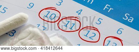 Sanitary Pads And Tampons Are On Calendar. Numbers Are Circled In Red Pen