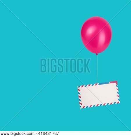 Air mail letter envelope flying by balloon message delivery concept isolated on vivid blue square background