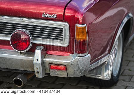 Alanya, Turkey  - April 13  2021:    Red Ford 20m . Taillight Of A  Red Retro Car Close-up. Shiny Gl