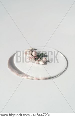 A Drop Of Cosmetic Gel With Flower On A White Background.