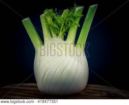 Green White Fennel On Brown Olive Wood