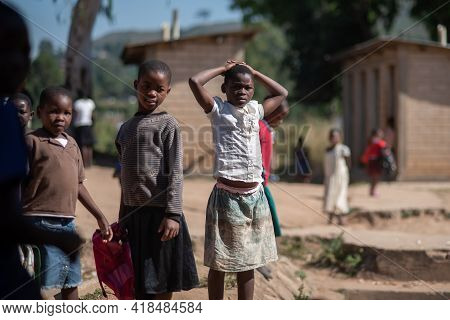Mzuzu, Malawi. 30-05-2018. Group Of Black Children Gather In Front Of The Camera After Finishing Sch