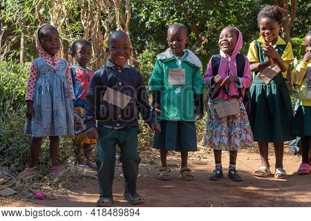 Mzuzu, Malawi. 30-05-2018. Group Of Black Children Standing Smiling To The Camera Outside Their Scho