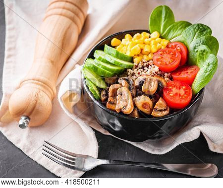 Bowl Of Healthy Quinoa With Vegetables On A Dark Rustic Background