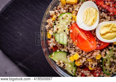 Bowl Of Healthy Quinoa With Vegetables On A Dark Rustic Background