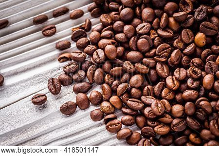 Aromatic Fresh Coffee Beans On A White Wooden Rustic Background