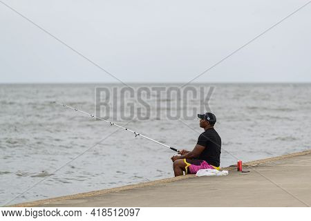 New Orleans, La - October 9: Man Fishes In Lake Pontchartrain On October 9, 2020 In New Orleans, Lou