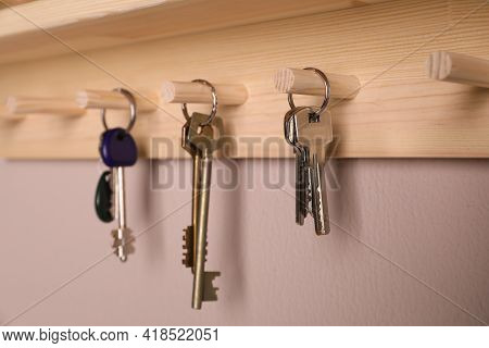 Wooden Hanger For Keys On Color Wall, Closeup