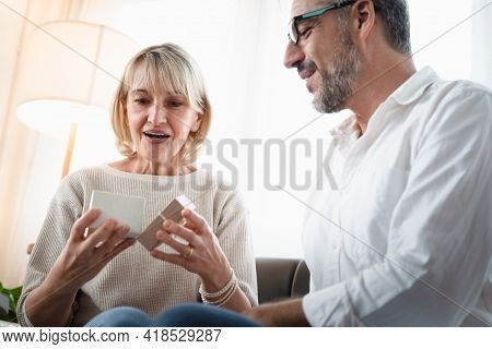Elderly Woman Surprisingly Face While Looking At The Present That Her Husband Give To Her, Romantic 