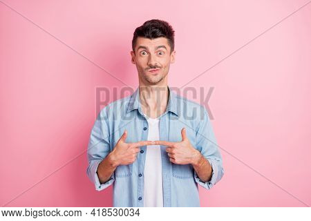 Photo Of Shy Funky Young Brunette Man Touch Fingers Together Isolated On Pastel Pink Color Backgroun