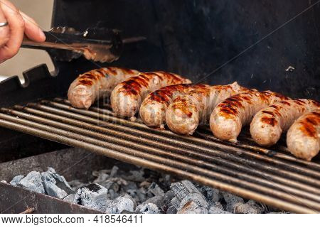 Delicious Grilled Sousages. Barbiquing Sousages On Hot Grill.
