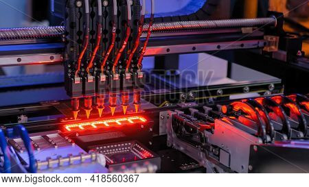 Automatic Smd Pick And Place Machine During Work - Assembly Of Computer Circuit Board At Factory. Au