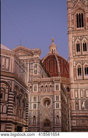 View at dome of Brunelleschi and Giotto bell in Florence by evening