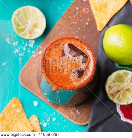Mexican Alcohol Cocktail Michelada With Dark Beer And Lime Juice