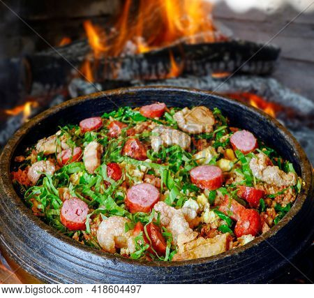 Beans with pork, called tropeiro beans, typical Brazilian food, state of Minas Gerais.